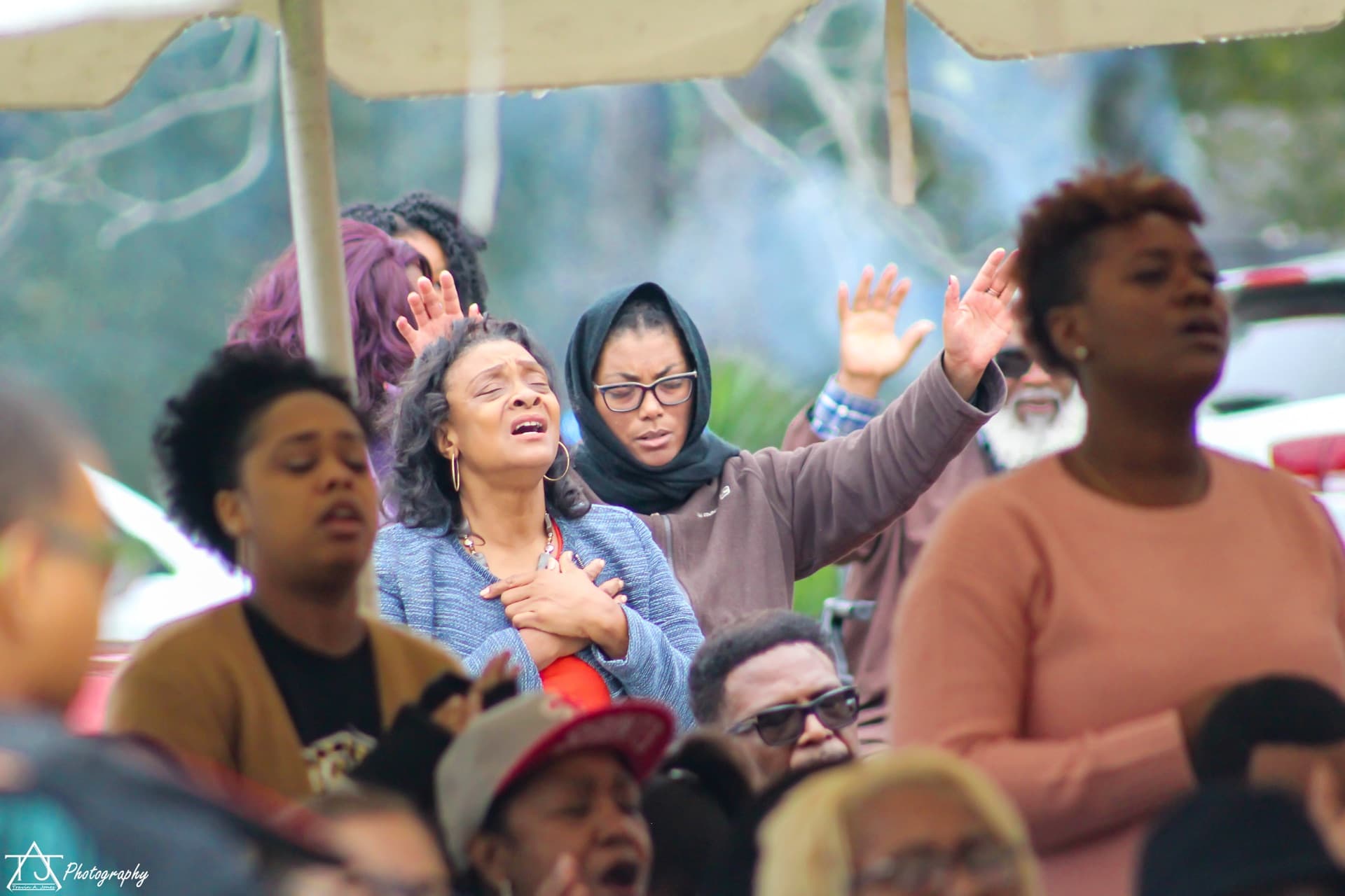 Congregation worshipping outdoors at Celebrate Recovery